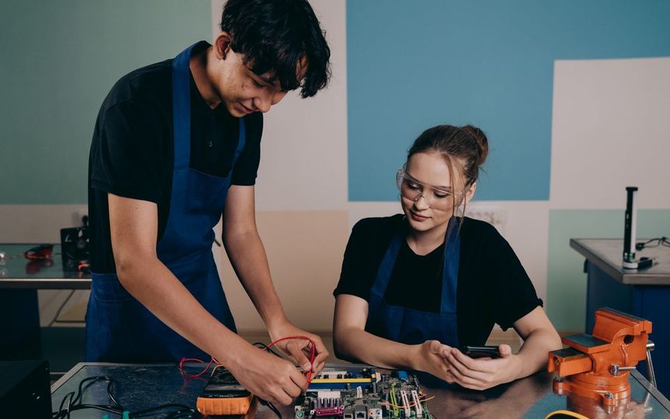Engineers testing a circuit board