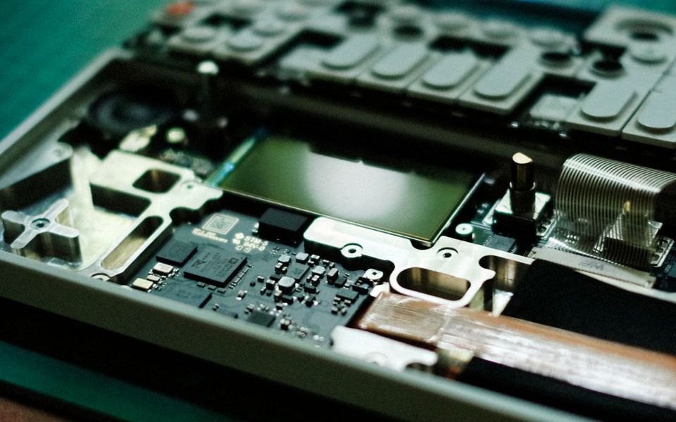 Opened laptop showing the motherboard and components