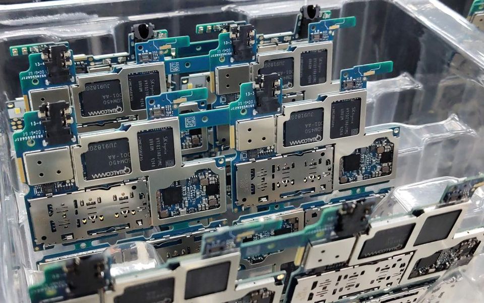 Smartphone main boards in a repair workshop